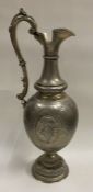 A fine Judaica Victorian floral silver wine jug decoratively displaying cartouches.