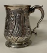 A very heavy 18th Century Georgian chased silver mug. London 1757.