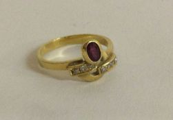 An 18 carat gold ruby and diamond mounted cocktail ring.