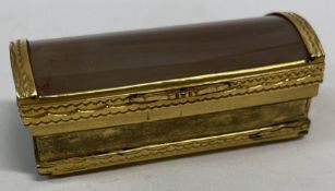 An early 19th Century silver gilt metal and agate snuff box.