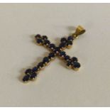 A good large sapphire cross in gold mount with loop top.