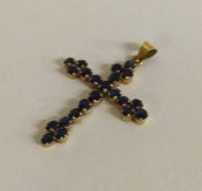 A good large sapphire cross in gold mount with loop top.