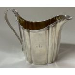 A George III silver reeded jug. London 1803.