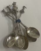 A set of six silver golfing spoons.