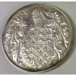 A silver coin commemorating Edward the Black Prince inscribed '1330 - 1378'.