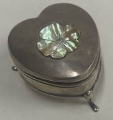A heart shaped novelty silver jewellery box with Mother of Pearl central plaque. Birmingham 1910.