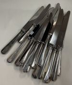A good set of eight (plus four plus four) OE pattern silver plated knives. Est. £30 - £50.