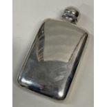 A heavy silver hip flask with hinged lid. London 1902. By Alexander Clark.