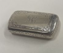 A Victorian engraved silver snuff box with hinged lid. Birmingham 1876. By Hilliard and Thompson.