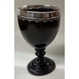 An 18th Century Provincial silver mounted coconut cup.