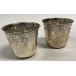 A fine pair of 18th Century silver beakers. Marked underneath.