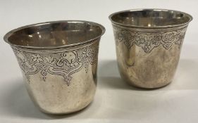 A fine pair of 18th Century silver beakers. Marked underneath.