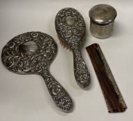 A chased silver brush set etc.