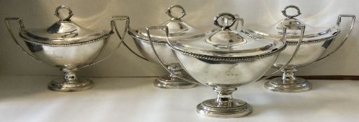 A fine set of four crested George III silver sauce tureens. London 1800. By William Pitts.