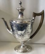 An large 18th Century silver coffee pot. London 1792. By John Robins.