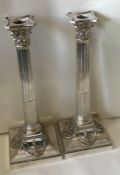 ELKINGTON AND CO: A large pair of Victorian silver neoclassical Corinthian candlesticks