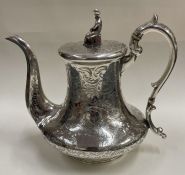 A very fine engraved silver chinoiserie teapot. Birmingham 1841.