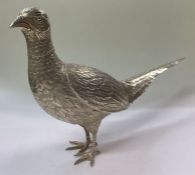 A large silver figure of a pheasant bearing import marks. By Israel Freeman & Son.