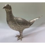 A large silver figure of a pheasant bearing import marks. By Israel Freeman & Son.