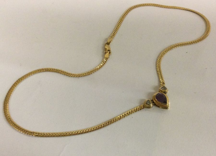 An 18 carat gold diamond and amethyst necklace. - Image 2 of 2