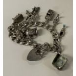 A heavy silver charm bracelet.