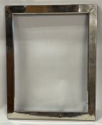 A large silver frame mount. Marked on side.