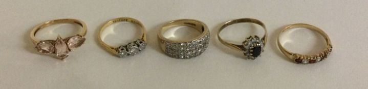 Five 9 carat diamond and gem stone rings.