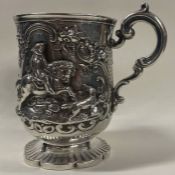 A fine Victorian silver mug embossed with a racing horse. London 1867. By Charles Edwards.