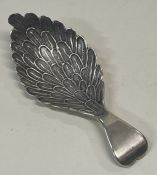 A George III silver caddy spoon with leaf patterned bowl. Birmingham 1808. By William Pugh.