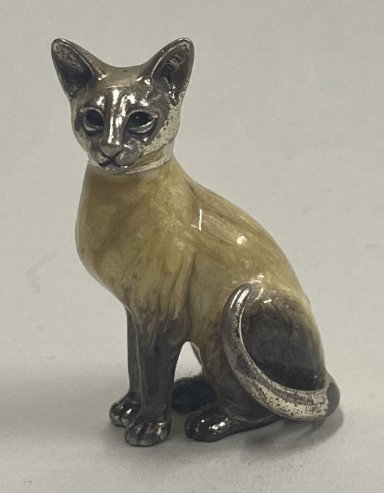 A silver and enamelled figure of cat.