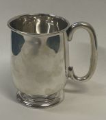 A heavy silver christening mug. Sheffield 1959. By Emilie Viner.