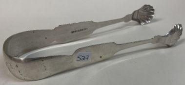 A pair of early American silver tongs. By J L Moore.