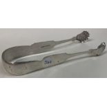 A pair of early American silver tongs. By J L Moore.