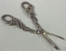 OF HUNTING INTEREST: A pair of silver grape scissors with fox design.