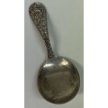 A fine American chased silver caddy spoon. By Kirk & Son.