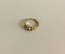 A heavy amethyst single stone ring in 9 carat mount.