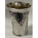 A Charles II style silver beaker chased with thistles. London 1970. By Haviland-Nye.