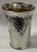 A Charles II style silver beaker chased with thistles. London 1970. By Haviland-Nye.