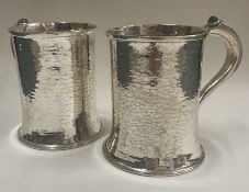 A rare pair of Arts and Crafts silver and stone hammered tankards. Birmingham 1917.