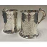 A rare pair of Arts and Crafts silver and stone hammered tankards. Birmingham 1917.