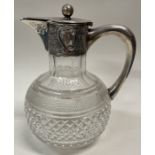 An Edwardian chased silver and glass claret jug. Birmingham 1908.