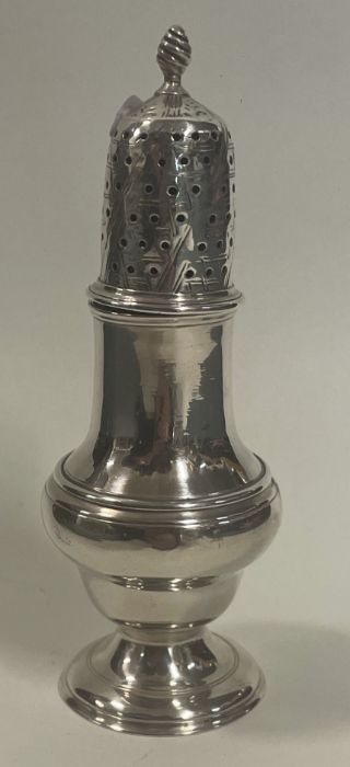 A heavy 18th Century George II silver sugar caster. London 1747. By Samuel Wood.