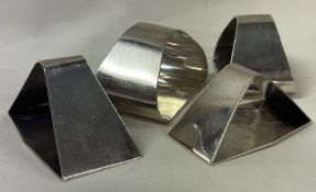 OF JUBILEE INTEREST: Four contemporary silver napkin rings. London 1977.