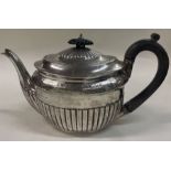 A Victorian silver bachelor teapot. London 1882. By Walter & John Barnard.