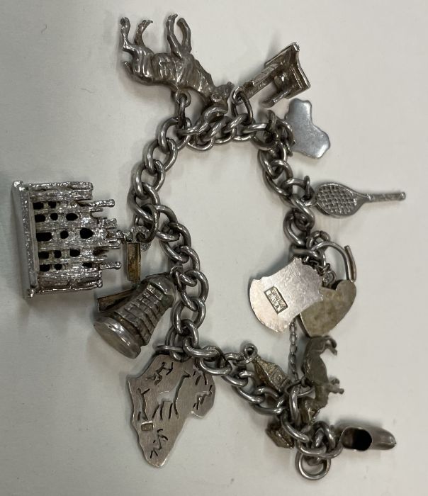 A heavy silver charm bracelet.