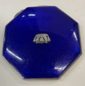 A silver and blue enamelled compact embossed with a crown to the centre. Birmingham 1940. By JWB.
