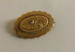 An 18 carat two colour gold brooch.