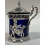 An unusual French silver mustard pot pierced with Thai style decoration. c1900.