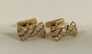 A fine pair of 18 carat gold diamond cufflinks of