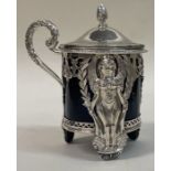 An unusual French silver mustard pot pierced with cherubs and dogs. c1900.